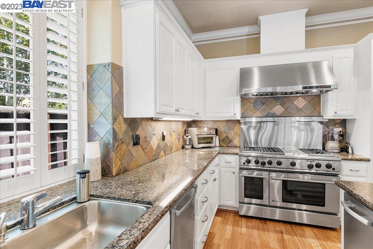 Undisclosed Address San Ramon, CA 94583 - Photo 25 of 57 a kitchen with stainless steel appliances granite countertop a sink and a stove