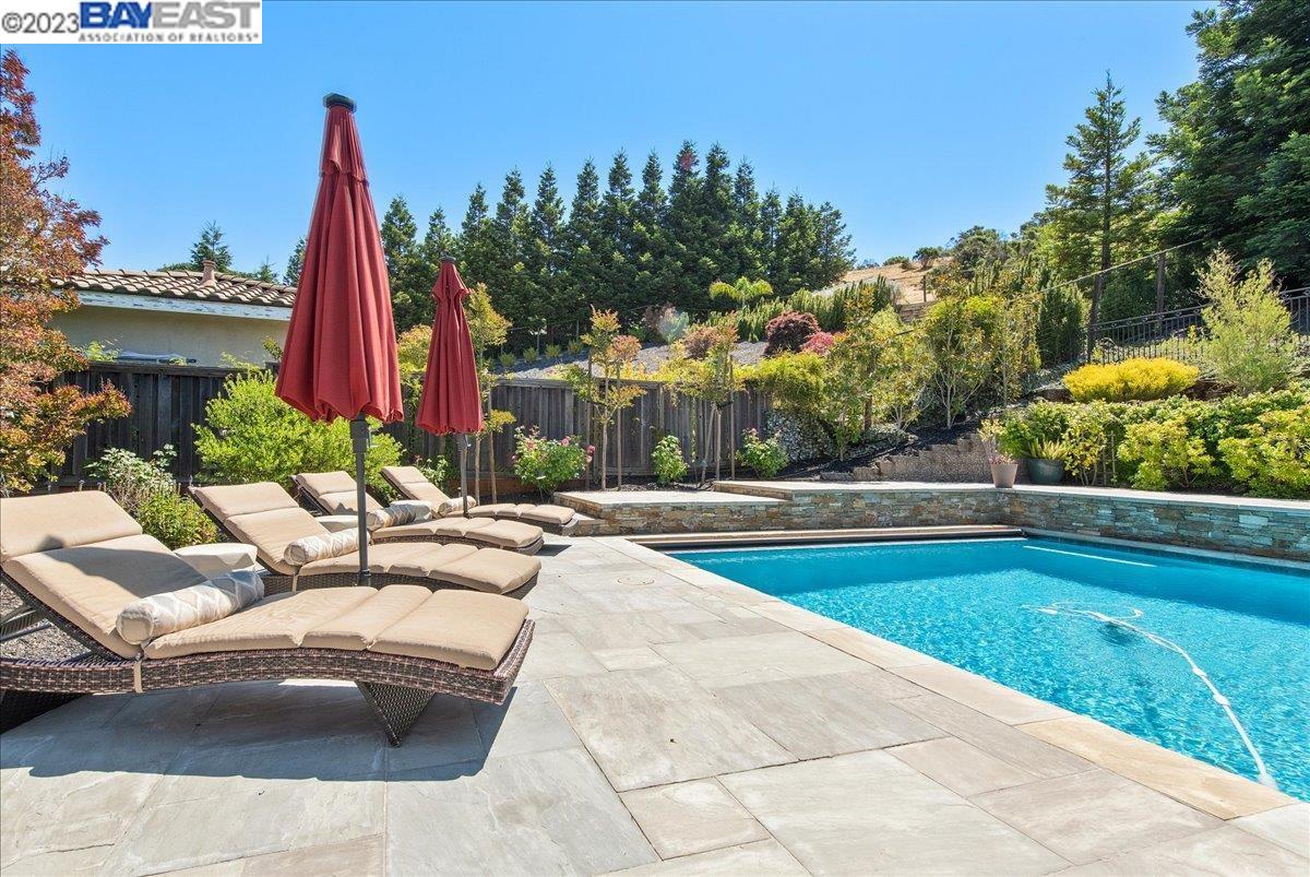 Undisclosed Address San Ramon, CA 94583 - Photo 54 of 57 a view of swimming pool with outdoor seating and plants