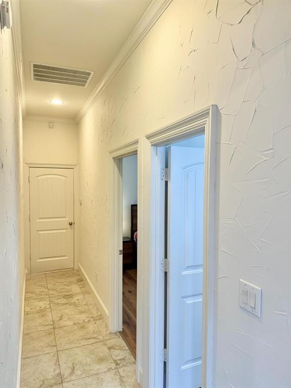 2300 Berend Road Pilot Point, TX 76258 - Photo 24 of 39 Corridor with crown molding and a textured wall