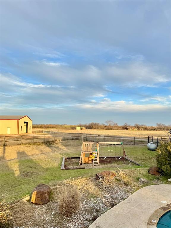 2300 Berend Road Pilot Point, TX 76258 - Photo 32 of 39 View of yard with a playground and a view of rural / pastoral area