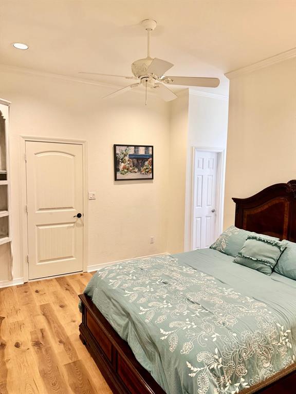2300 Berend Road Pilot Point, TX 76258 - Photo 9 of 39 Bedroom with light wood-type flooring, ornamental molding, and ceiling fan