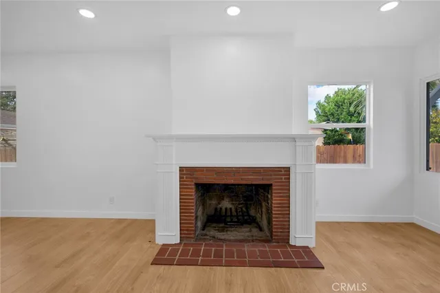 a living room with a fireplace and a fireplace