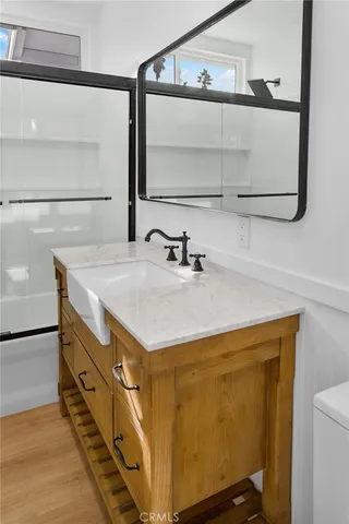 a bathroom with a sink and a mirror