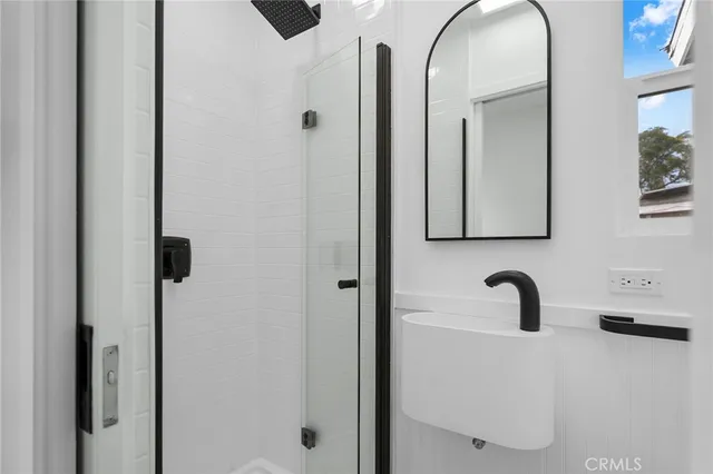 a bathroom with a tub and a sink