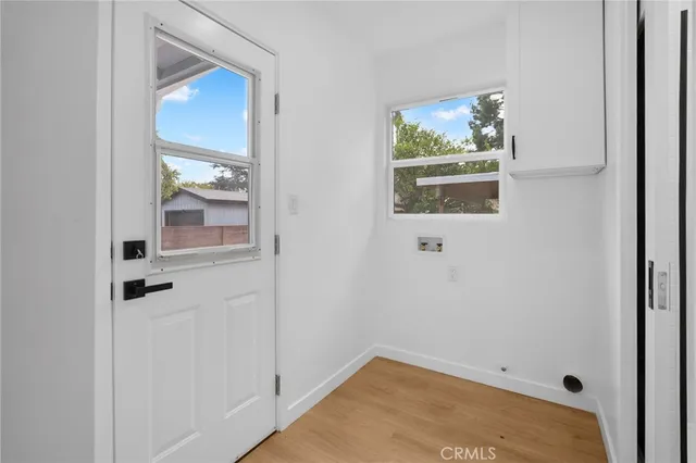 a view of a hallway with paintings on the wall