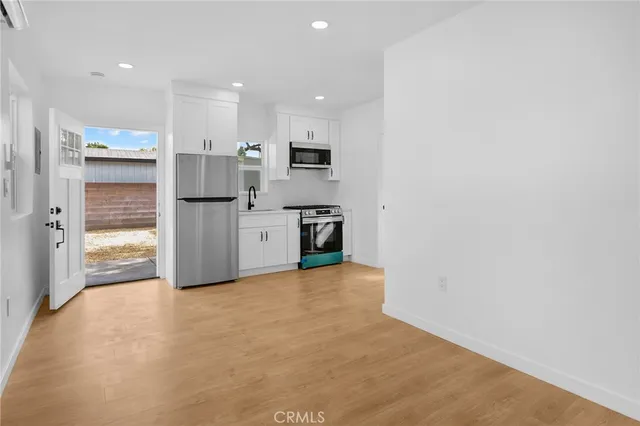 a view of kitchen with wooden floor