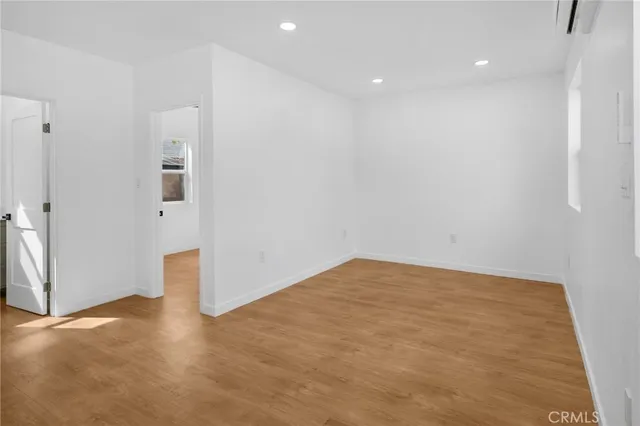 a view of kitchen with refrigerator and microwave