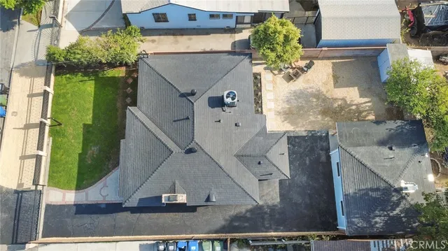 a view of a chairs and a fire pit in the patio