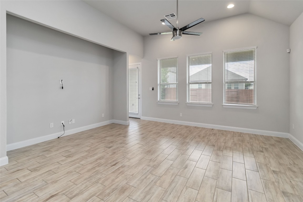 112 Barrel Bend Georgetown, TX 78628 - Photo 16 of 39 an empty room with wooden floor and windows