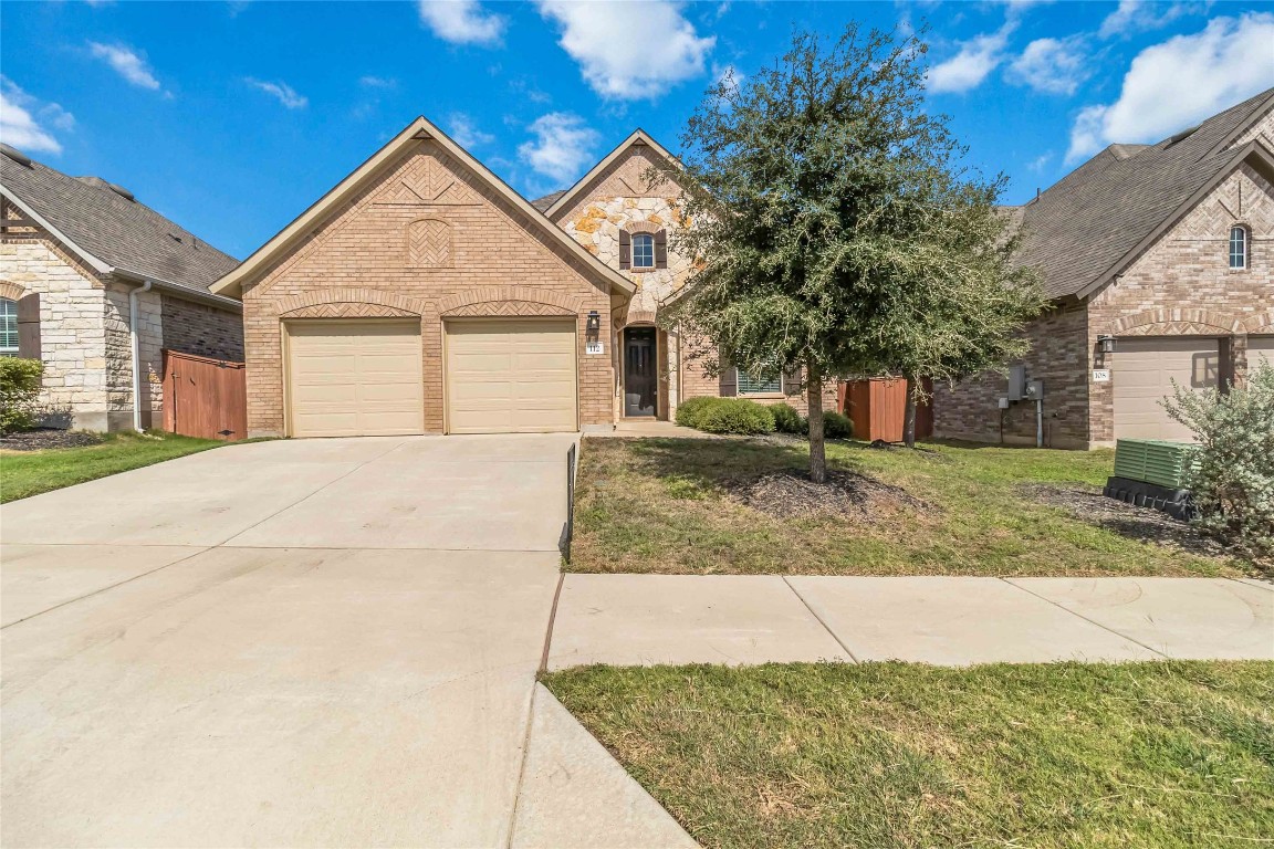 112 Barrel Bend Georgetown, TX 78628 - Photo 3 of 39 a front view of a house with a yard
