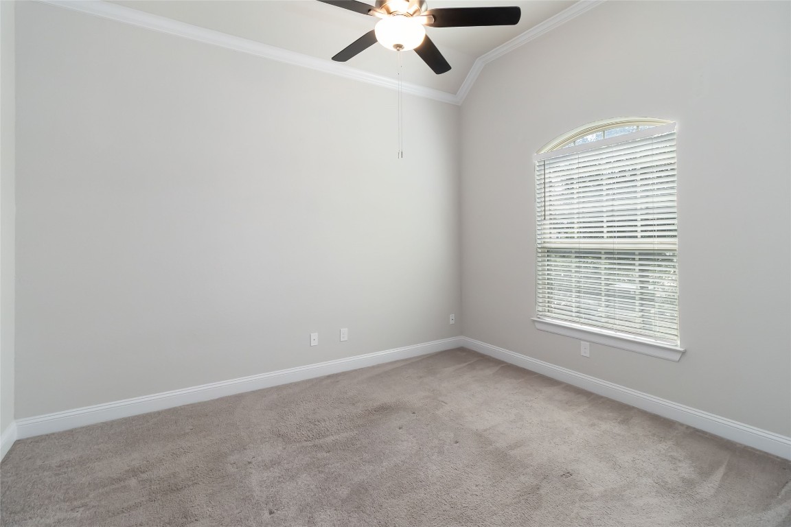 112 Barrel Bend Georgetown, TX 78628 - Photo 8 of 39 an empty room with a window and a fan