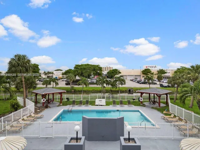 a view of a swimming pool with a patio