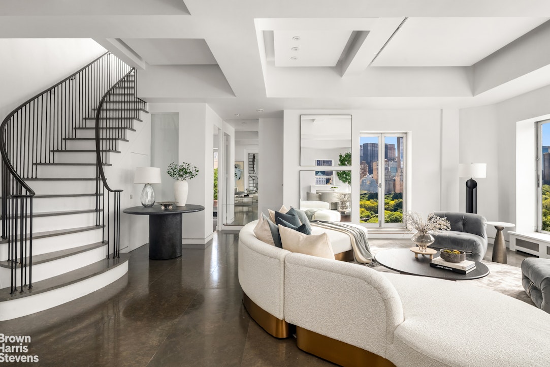 880 5th Avenue, Unit PHF Manhattan, NY 10021 - Photo 7 of 16 a living room with furniture kitchen view and a large window
