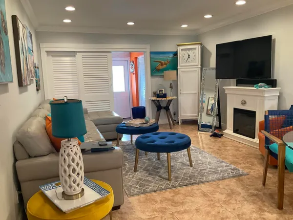 a living room with furniture and a rug