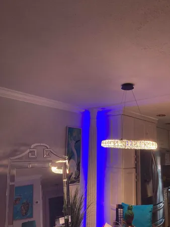 a living room with furniture and a lamp