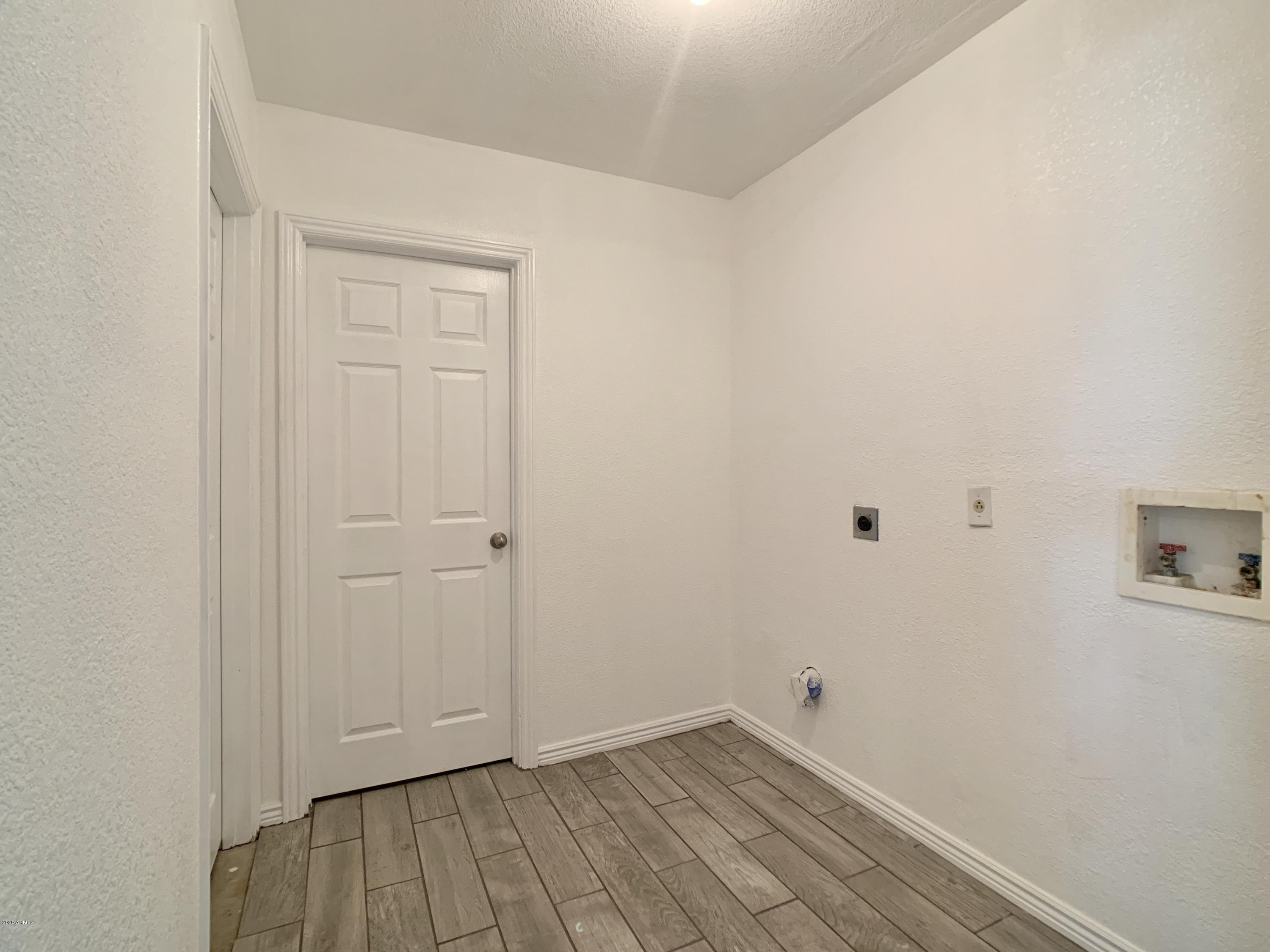 22232 West Lower Buckeye Road Buckeye, AZ 85326 - Photo 8 of 25 Laundry off of Kitchen Leading into the