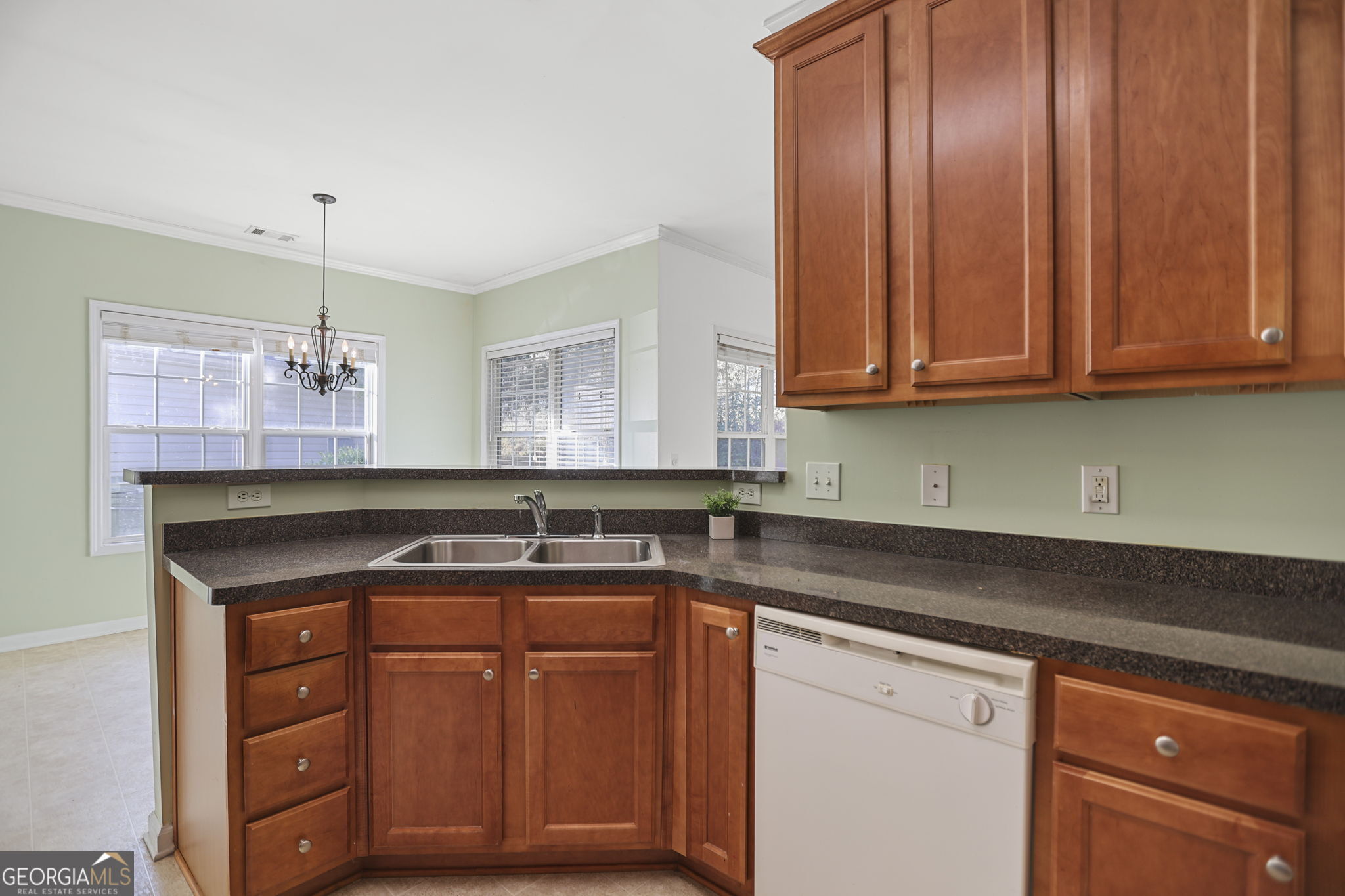 214 Meadow Run Carrollton, GA 30116 - Photo 13 of 44 a kitchen with granite countertop a sink and cabinets