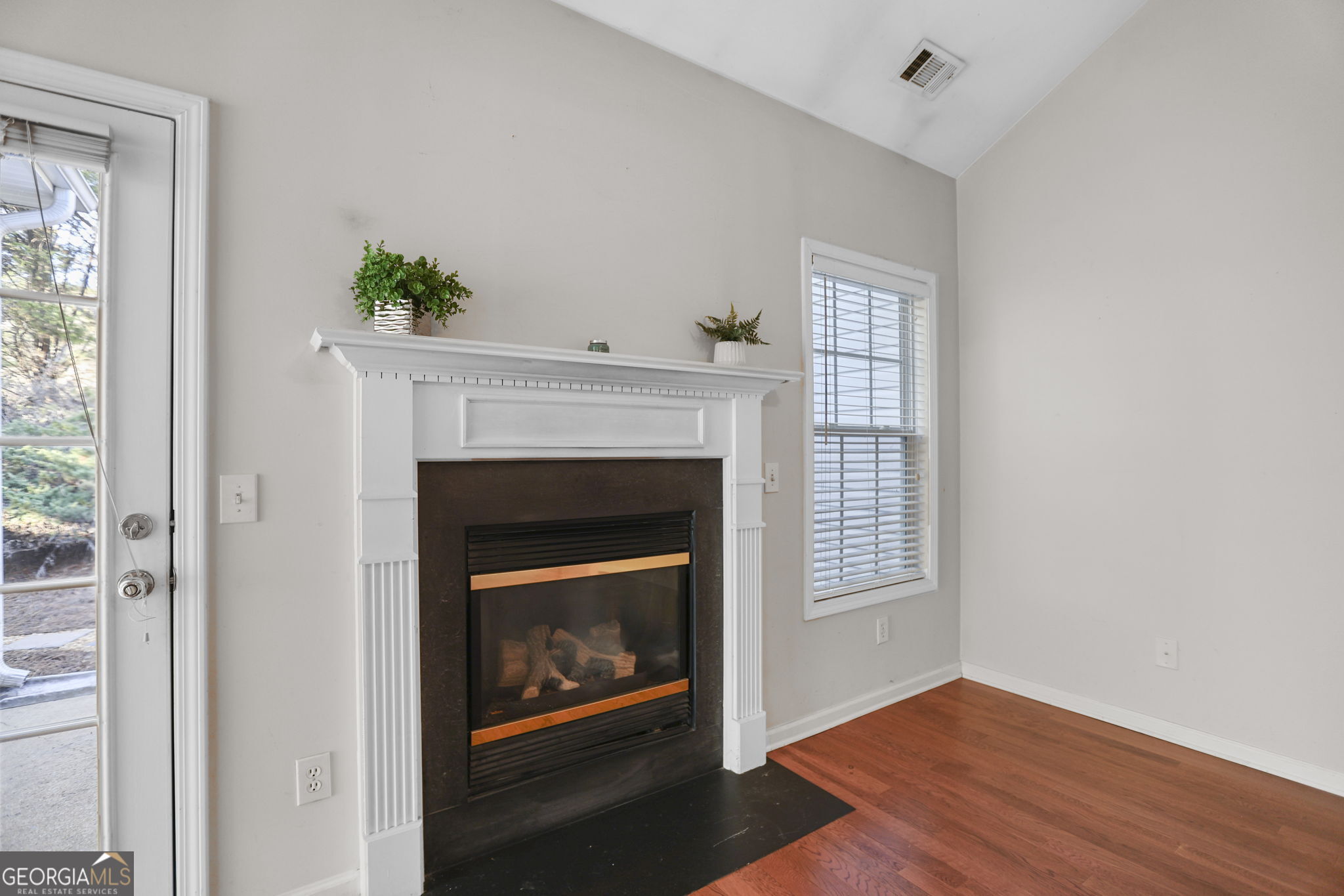 214 Meadow Run Carrollton, GA 30116 - Photo 24 of 44 a living room with a fireplace