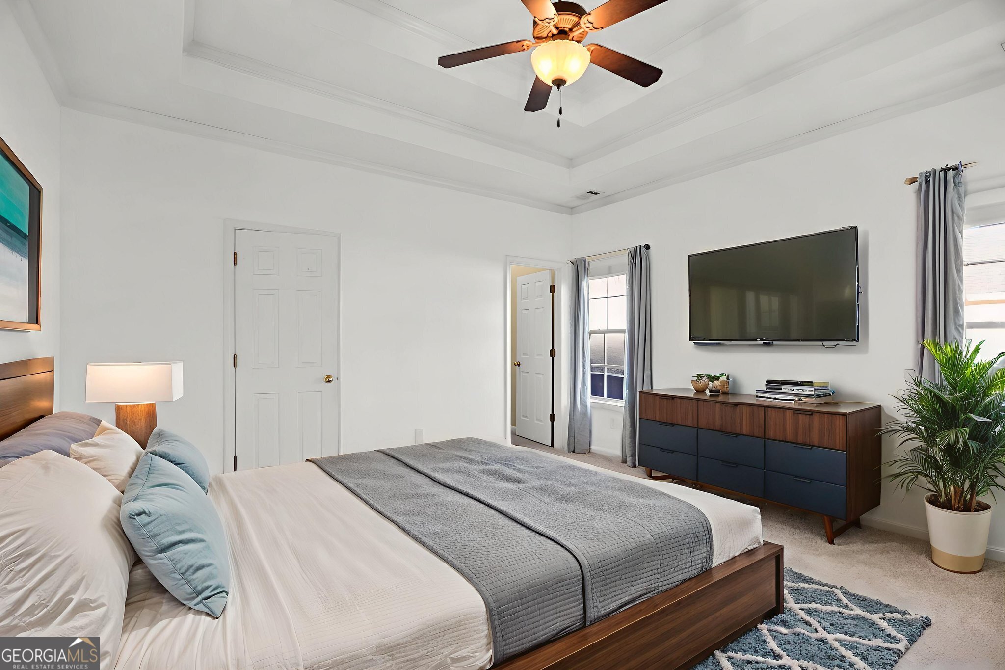 214 Meadow Run Carrollton, GA 30116 - Photo 29 of 44 a bedroom with a bed and a flat screen tv