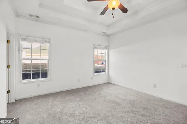 a bathroom with a sink a toilet and shower curtain