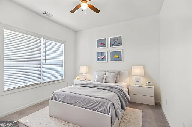 an empty room with windows and closet