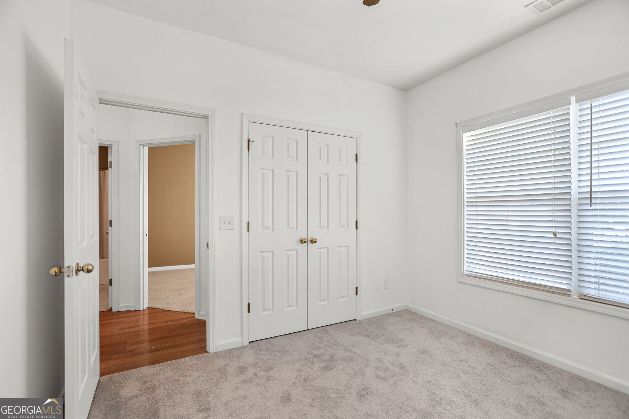 214 Meadow Run Carrollton, GA 30116 - Photo 38 of 44 an empty room with windows and closet