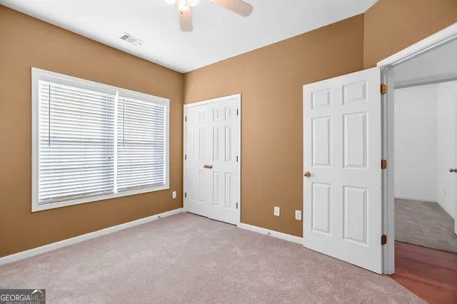 a view of a backyard with large trees