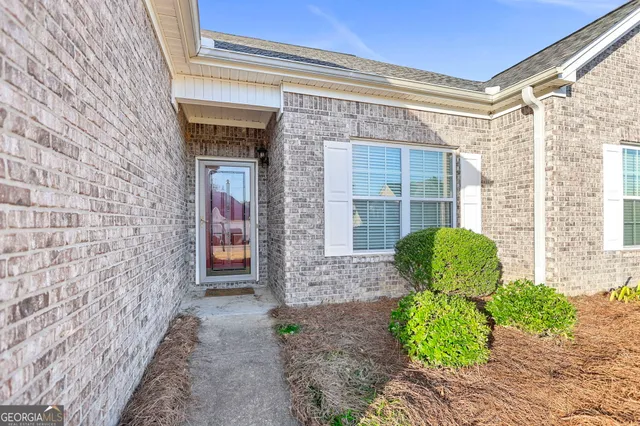 a front view of a house with outdoor space