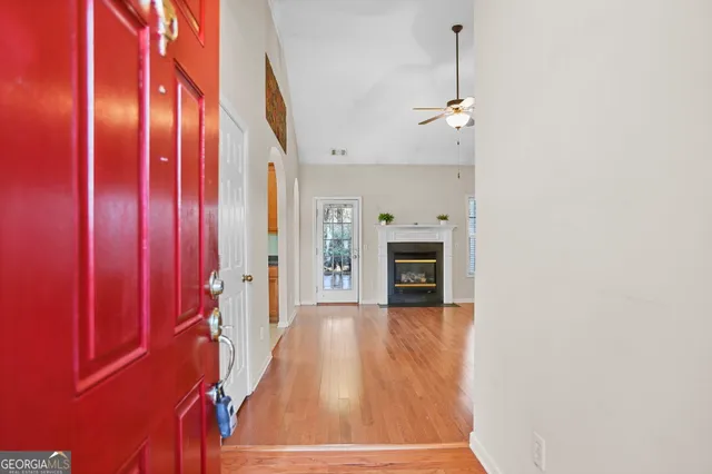 wooden floor in an empty room with a window