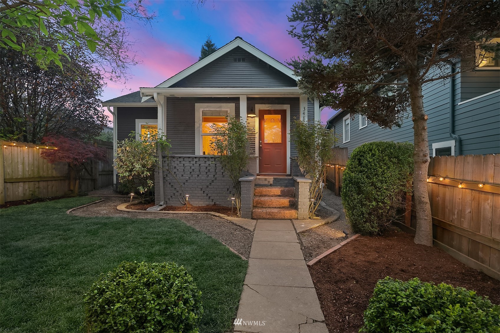 348 North 84th Street Seattle, WA 98103 - Photo 1 of 22 a front view of a house with garden