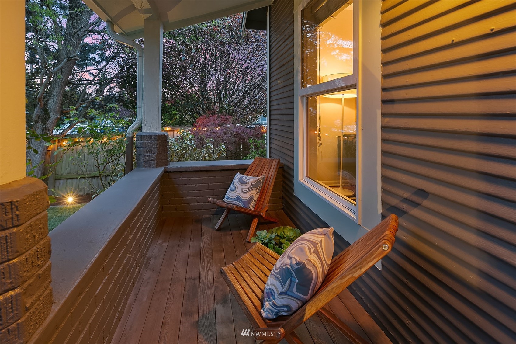 348 North 84th Street Seattle, WA 98103 - Photo 4 of 22 a balcony with wooden floor and outdoor seating