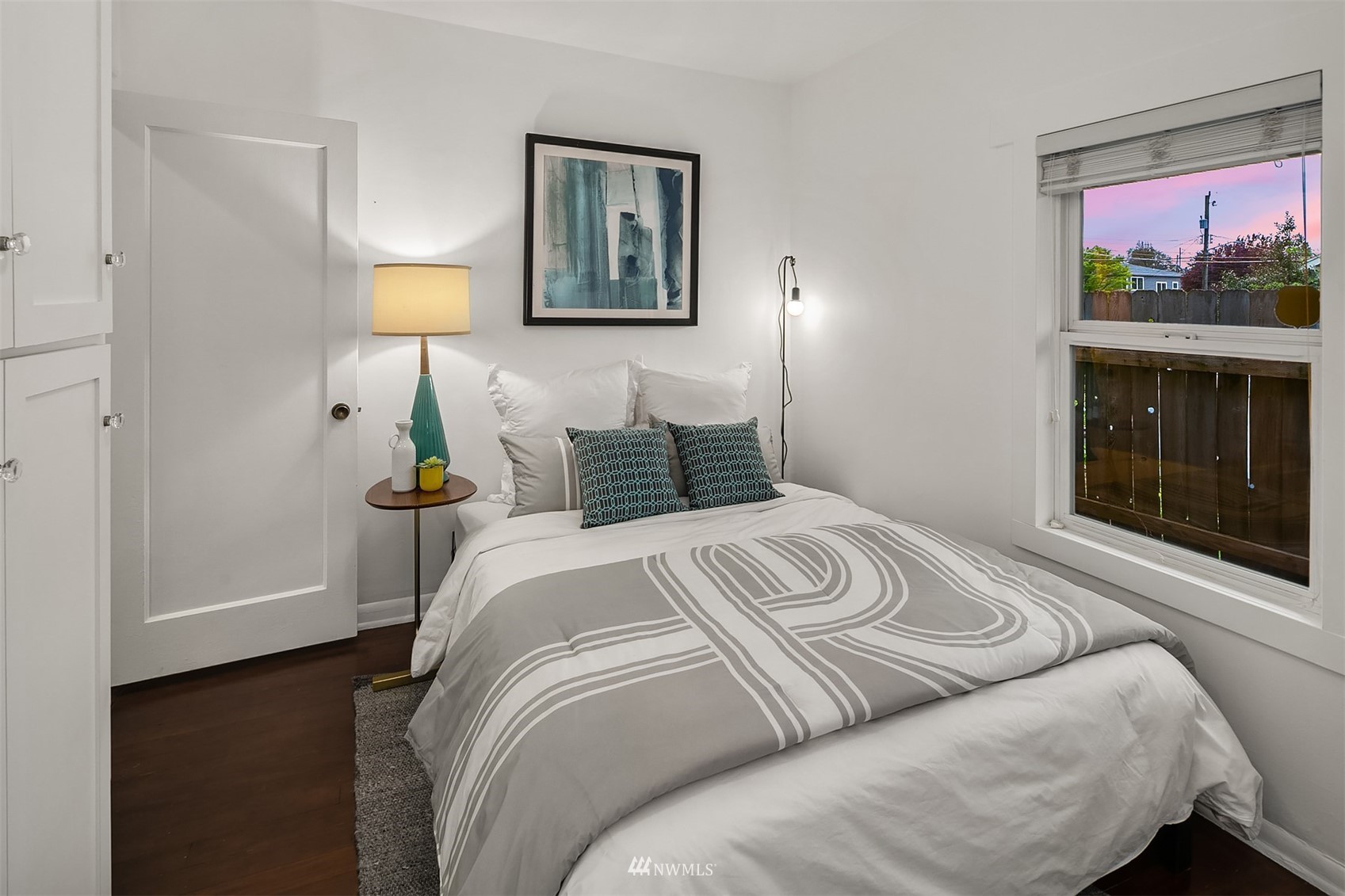 348 North 84th Street Seattle, WA 98103 - Photo 9 of 22 a bedroom with a bed and a painting on the wall