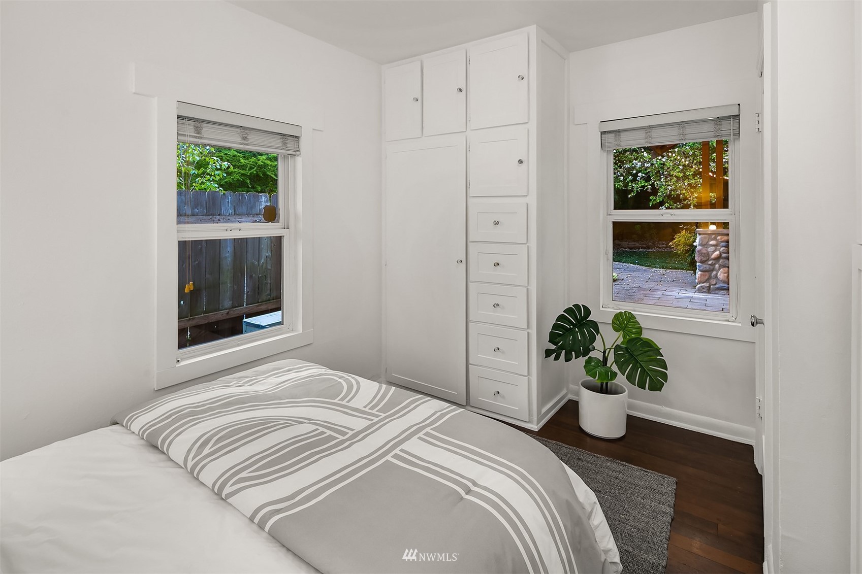 348 North 84th Street Seattle, WA 98103 - Photo 10 of 22 a bedroom with a bed and a potted plant