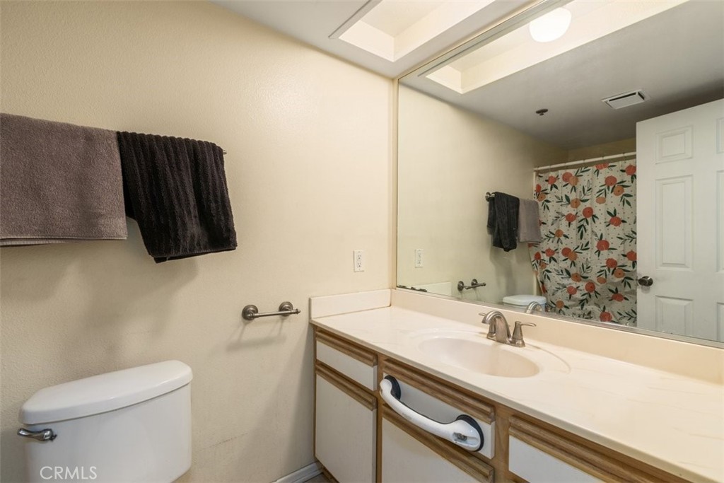 44544 15th Street East, Unit 9 Lancaster, CA 93535 - Photo 12 of 18 a bathroom with a sink and a mirror