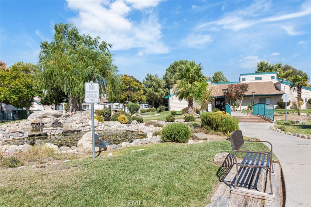 44544 15th Street East, Unit 9 Lancaster, CA 93535 - Photo 18 of 18 a view of multiple houses with yard and sitting area