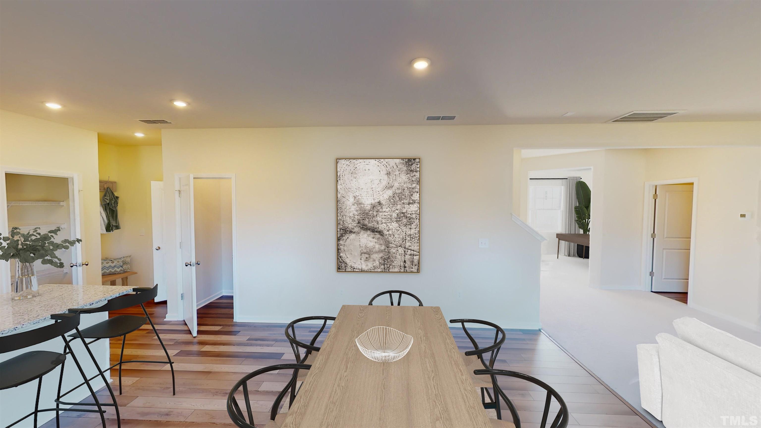 1436 Heron Pond Street Raleigh, NC 27604 - Photo 13 of 22 a dining room with furniture and wooden floor