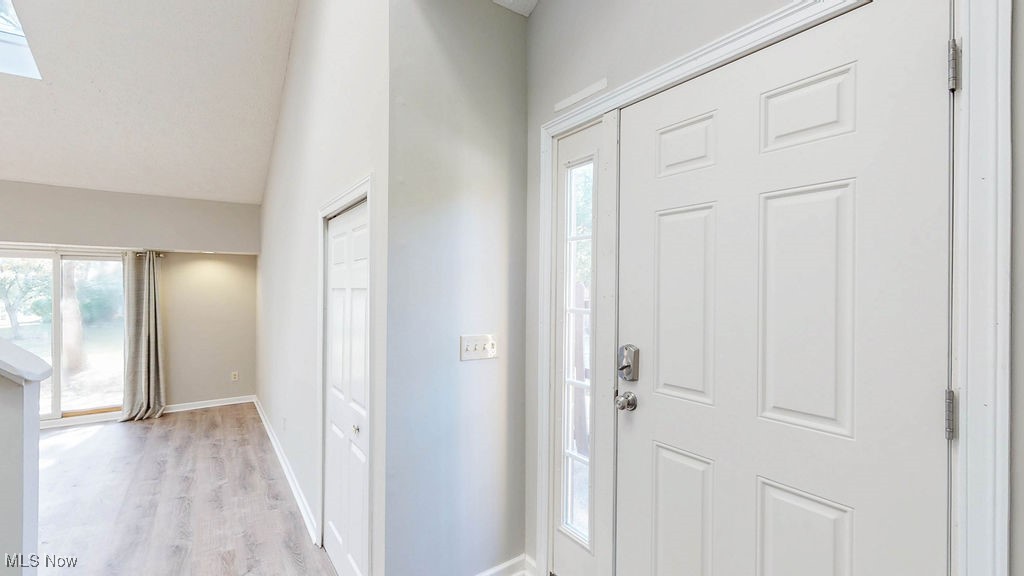 1426 Loop Road, Unit 1426 Kent, OH 44240 - Photo 4 of 40 Entrance foyer with light wood finished floors, vaulted ceiling, and a skylight