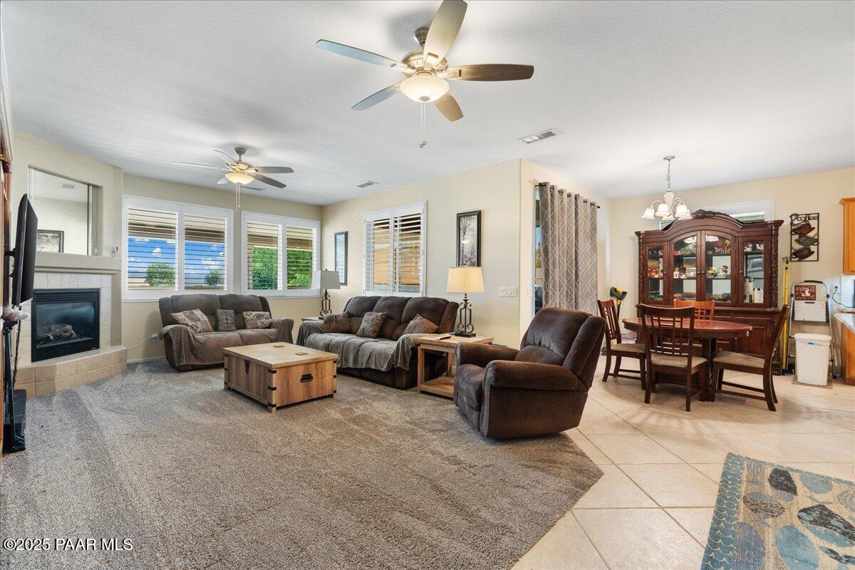 1915 North Bittersweet Way Prescott Valley, AZ 86314 - Photo 11 of 44 a living room with furniture kitchen view and a chandelier