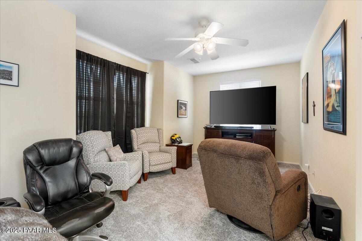 1915 North Bittersweet Way Prescott Valley, AZ 86314 - Photo 20 of 44 a living room with furniture and a flat screen tv