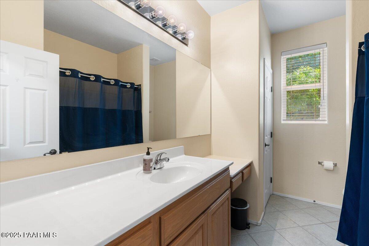 1915 North Bittersweet Way Prescott Valley, AZ 86314 - Photo 21 of 44 a bathroom with a sink and a mirror