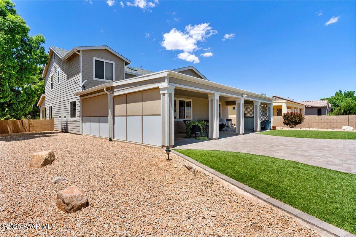 1915 North Bittersweet Way Prescott Valley, AZ 86314 - Photo 25 of 44 a front view of a house with a yard and garage