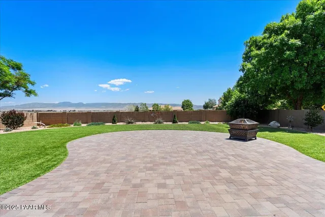 a view of a garden with an outdoor space