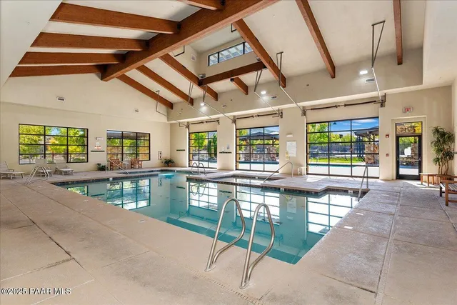 a room with lots of table and chairs