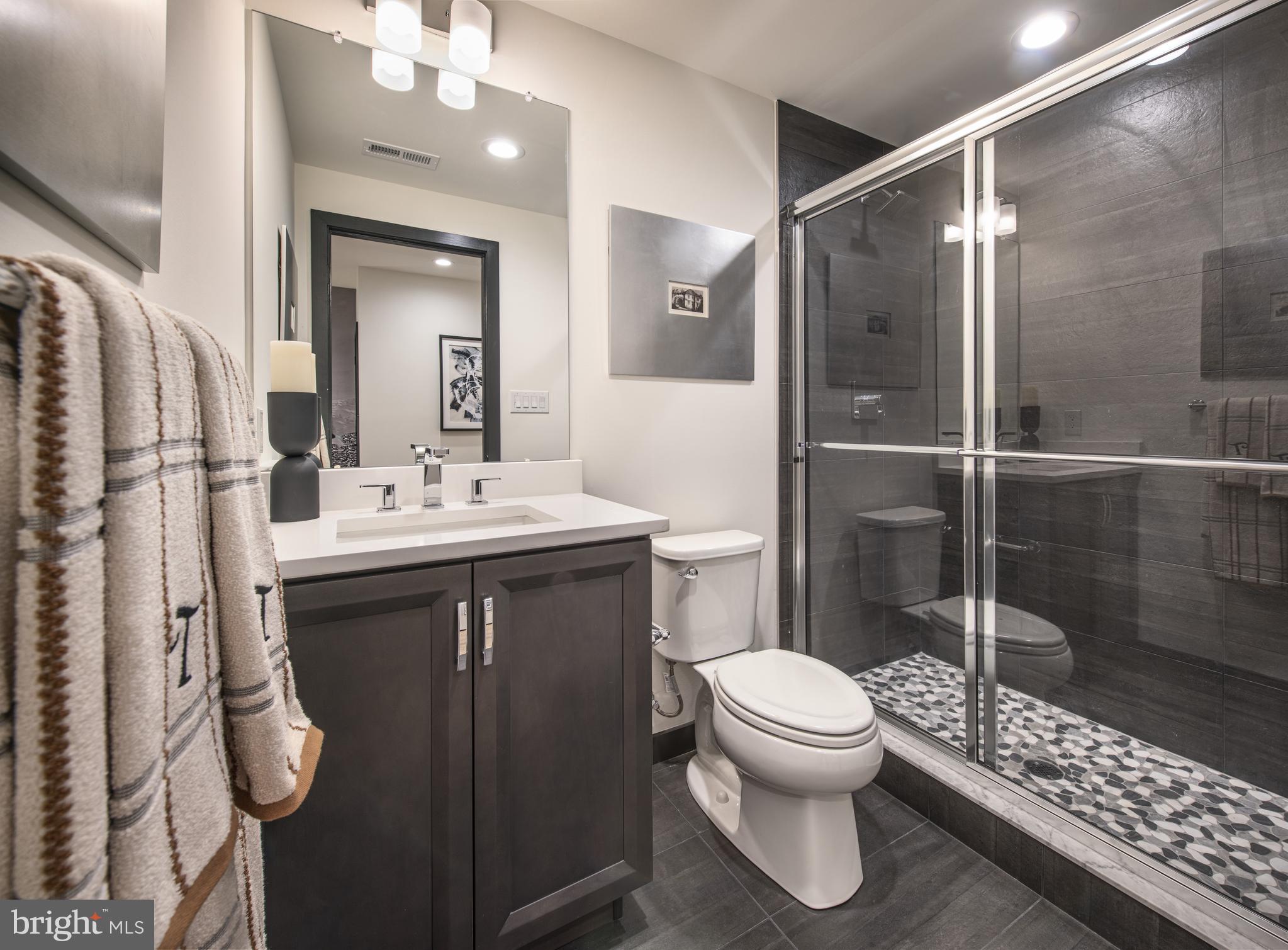 176 Alroy Road, Unit HOMESITE 242 Malvern, PA 19355 - Photo 5 of 19 a bathroom with a sink toilet and shower