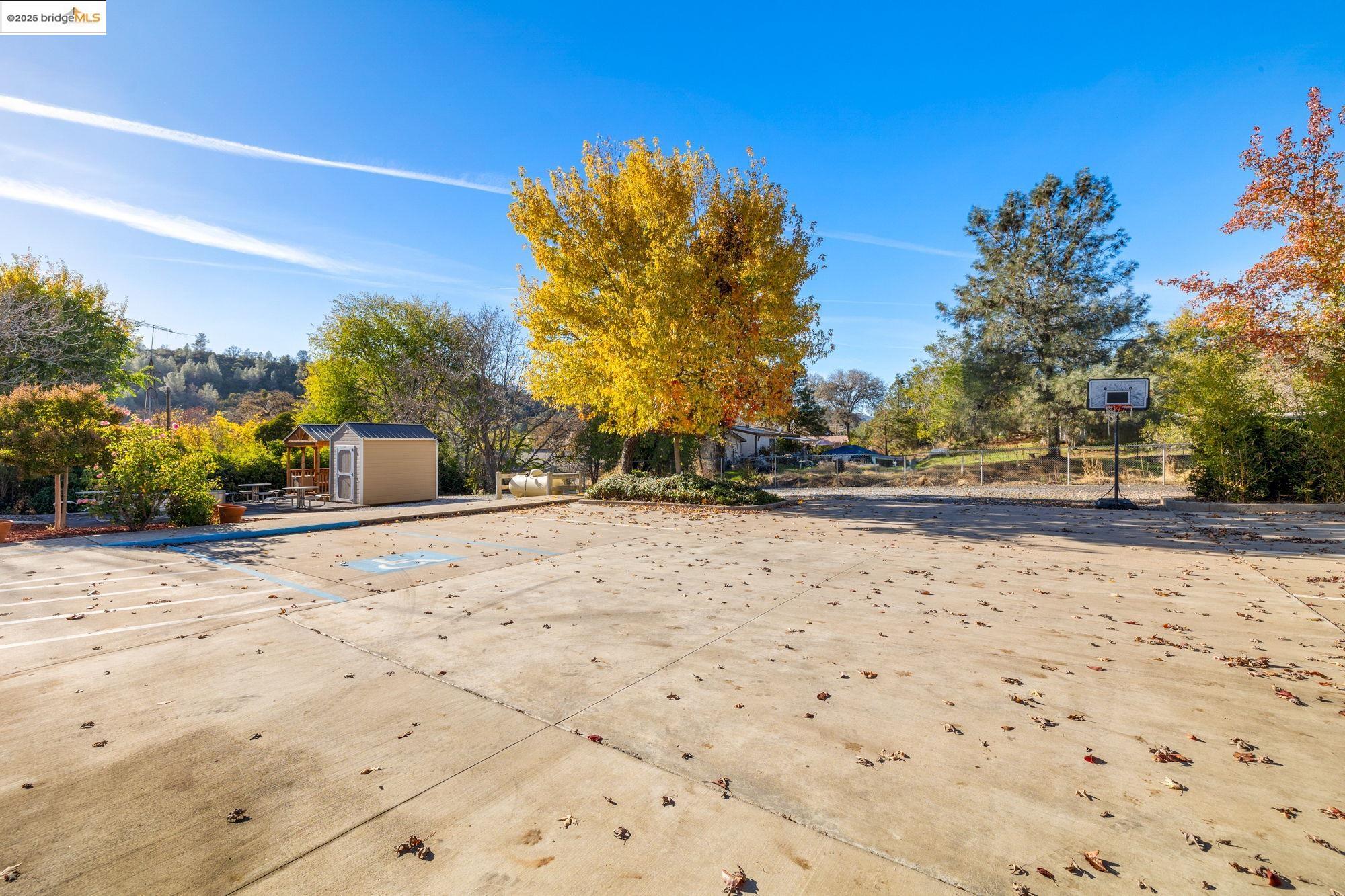 5033 Main Street Coulterville, CA 95311 - Photo 11 of 38 View of patio / terrace with a storage shed