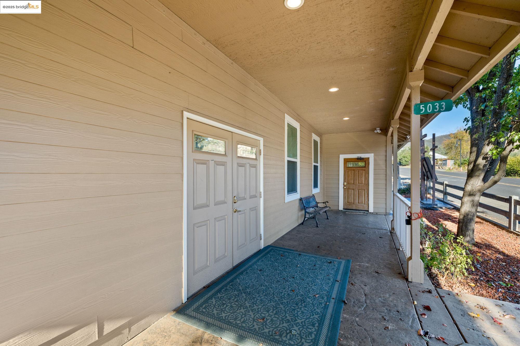 5033 Main Street Coulterville, CA 95311 - Photo 15 of 38 Doorway to property featuring covered porch