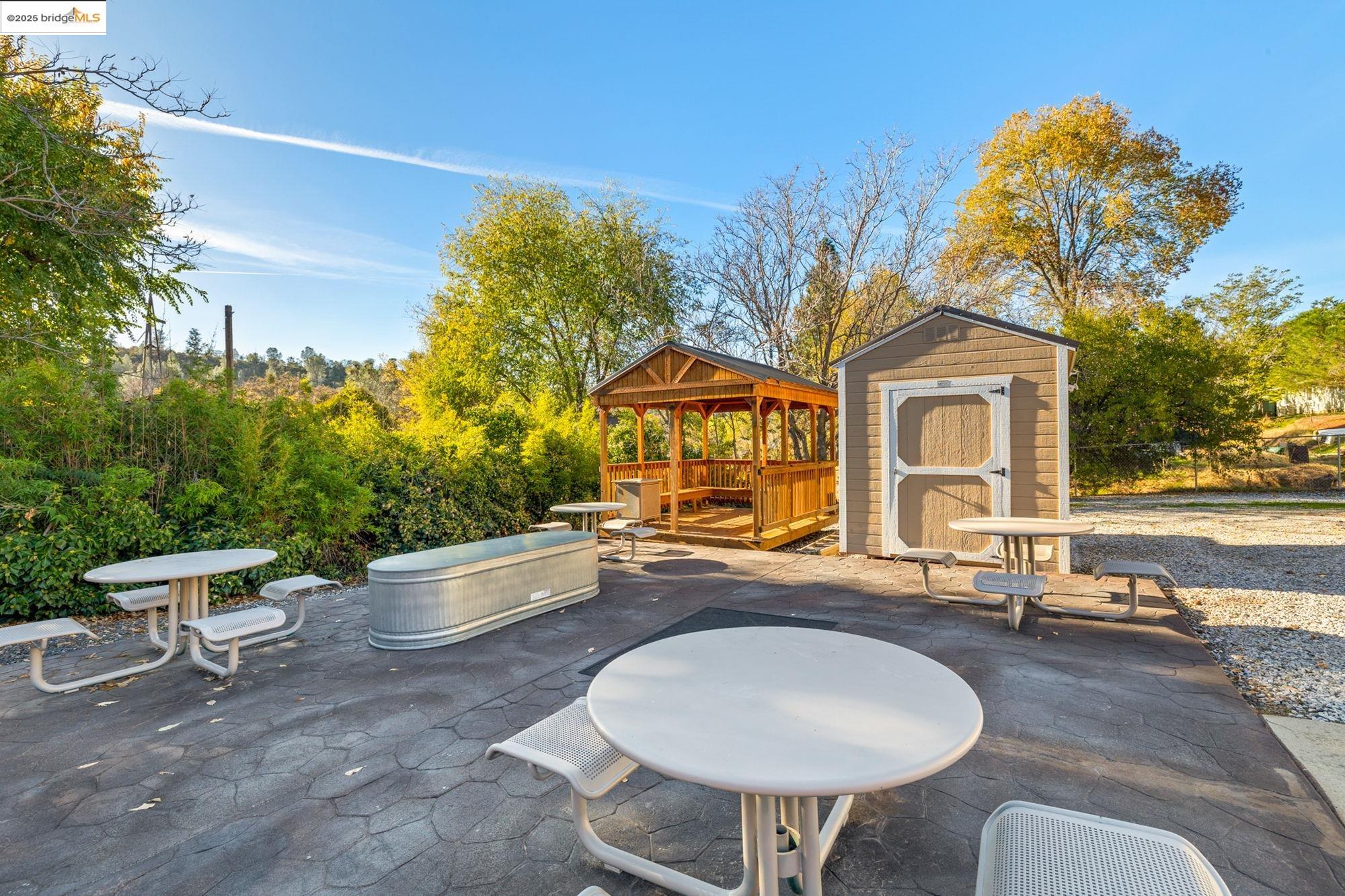 5033 Main Street Coulterville, CA 95311 - Photo 20 of 38 View of patio / terrace with a storage unit