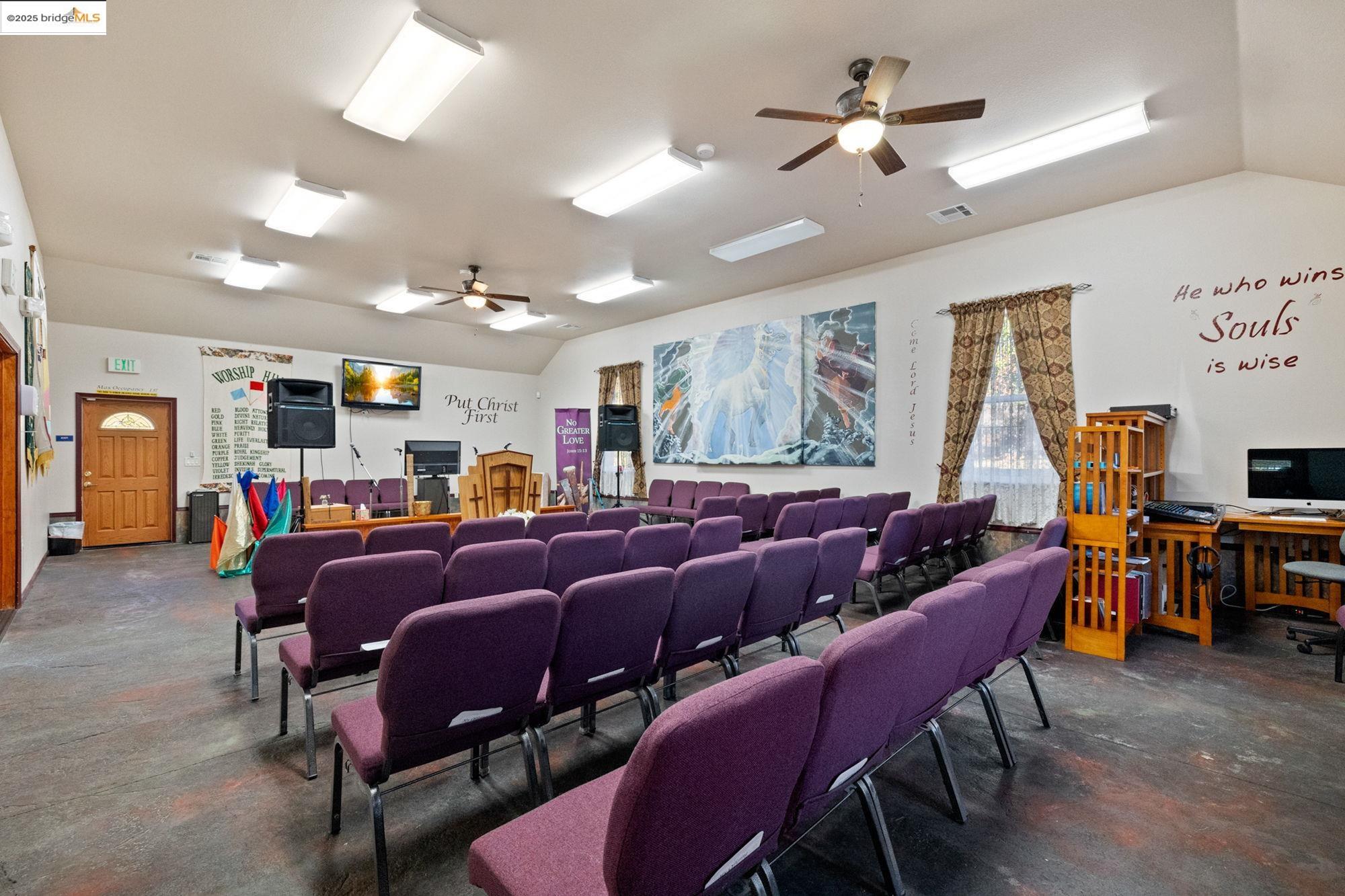 5033 Main Street Coulterville, CA 95311 - Photo 29 of 38 a living room with furniture a large window and a flat screen tv