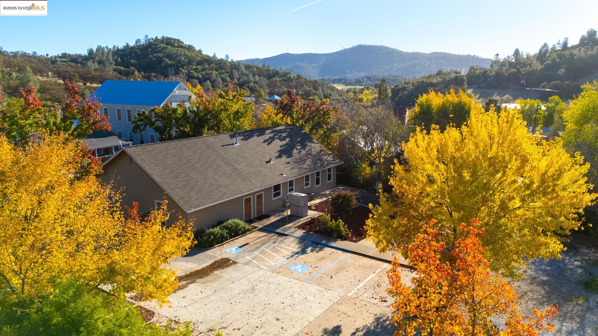 5033 Main Street Coulterville, CA 95311 - Photo 3 of 38 a view of a house with a mountain and a forest