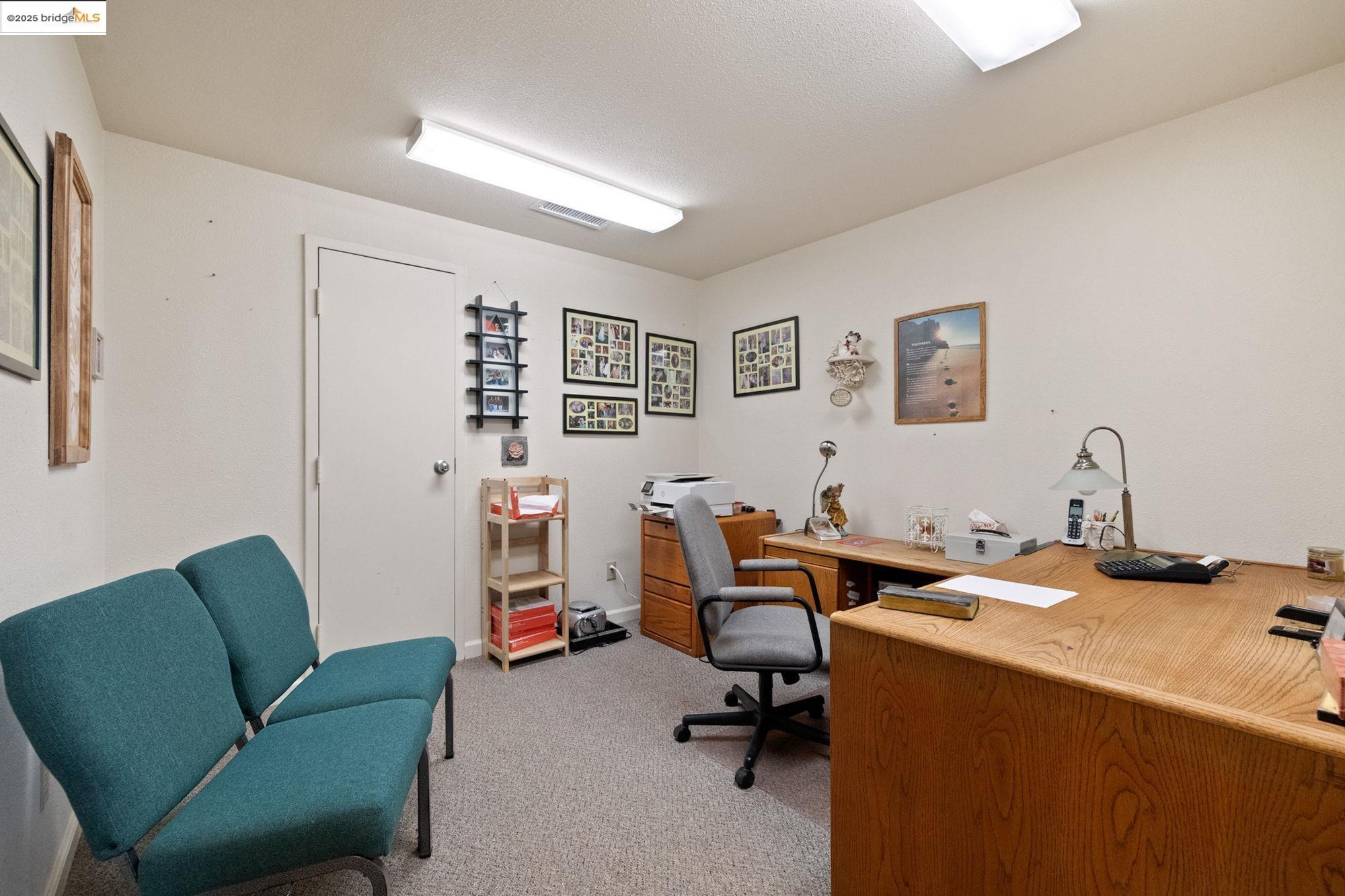 5033 Main Street Coulterville, CA 95311 - Photo 37 of 38 a view of a livingroom with workspace and a couch